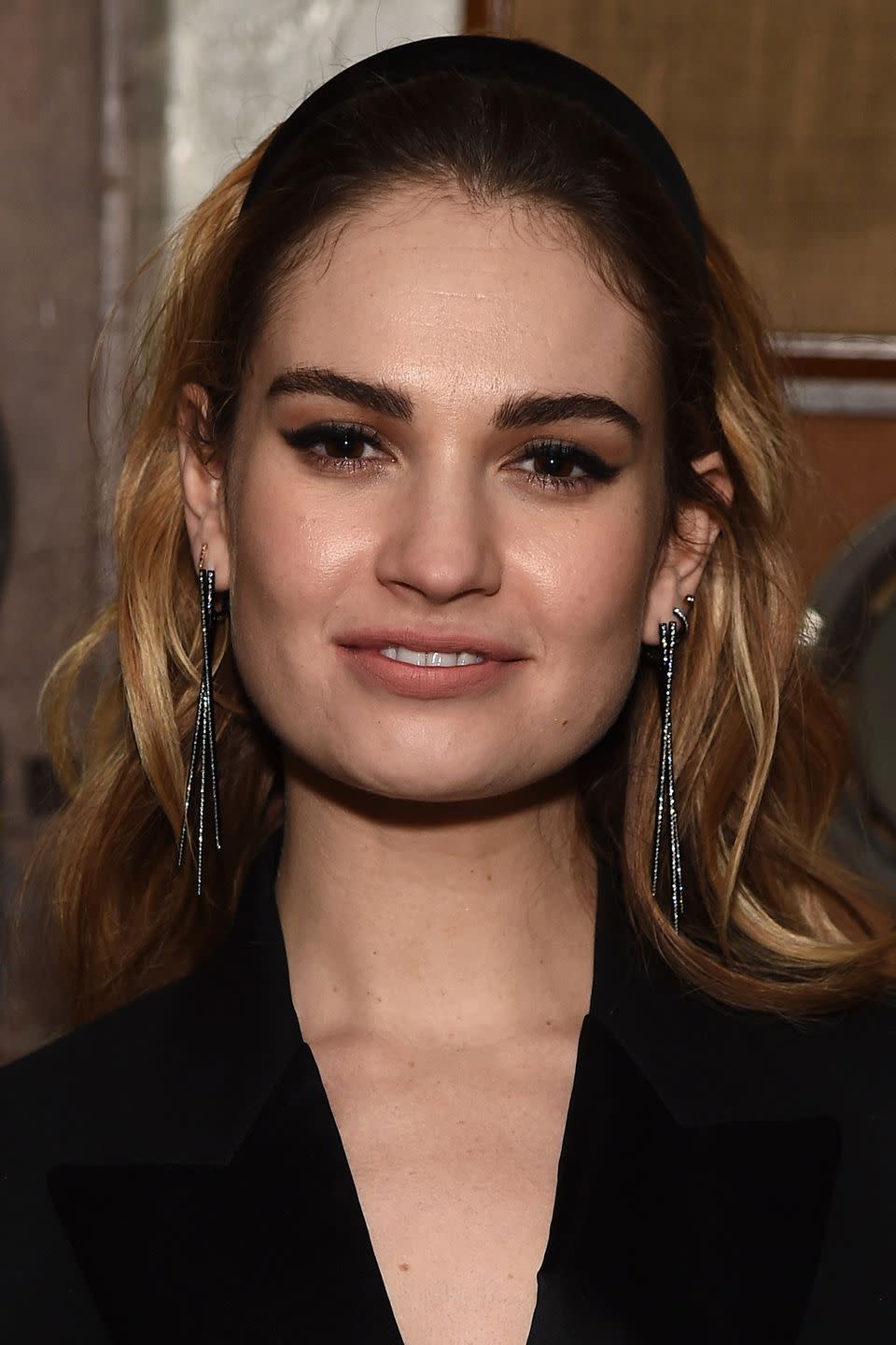 <p>To achieve perfect eyeliner flicks like Lily James, follow the advice of the make-up artist <a rel="nofollow noopener" href="https://www.harpersbazaar.com/uk/beauty/make-up-nails/news/a42429/adele-make-up-artist-eyeliner-tips/" target="_blank" data-ylk="slk:Michael Ashton;elm:context_link;itc:0;sec:content-canvas" class="link ">Michael Ashton</a> and apply your eyeliner in stages. Start, by defining the inner corner of your eyes with Marc Jacobs' <a rel="nofollow noopener" href="https://www.johnlewis.com/marc-jacobs-highliner-gel-eye-crayon/p2907203?sku=236420324&s_kwcid=2dx92700028128910580&tmad=c&tmcampid=2&gclid=CjwKCAjwiPbWBRBtEiwAJakcpHflJpFai1mpSOErtIeIuMg8hu0kthqB6pXcgmXRMrbGuyjOGsaCIBoCO9oQAvD_BwE&gclsrc=aw.ds" target="_blank" data-ylk="slk:Highliner in Blacquer;elm:context_link;itc:0;sec:content-canvas" class="link ">Highliner in Blacquer</a>, £20, then draw a line from the outer corners inwards to form a straight, joined up line. Only then, create your flicks and, if you make a mistake, use Muji's <a rel="nofollow noopener" href="http://www.muji.eu/pages/online.asp?LAN=UK&ShopSel=y&scrn=1920&wndw=1920&Sec=17&Sub=70&PID=2469" target="_blank" data-ylk="slk:Cotton Buds;elm:context_link;itc:0;sec:content-canvas" class="link ">Cotton Buds</a>, £3.50, to tidy up.</p>