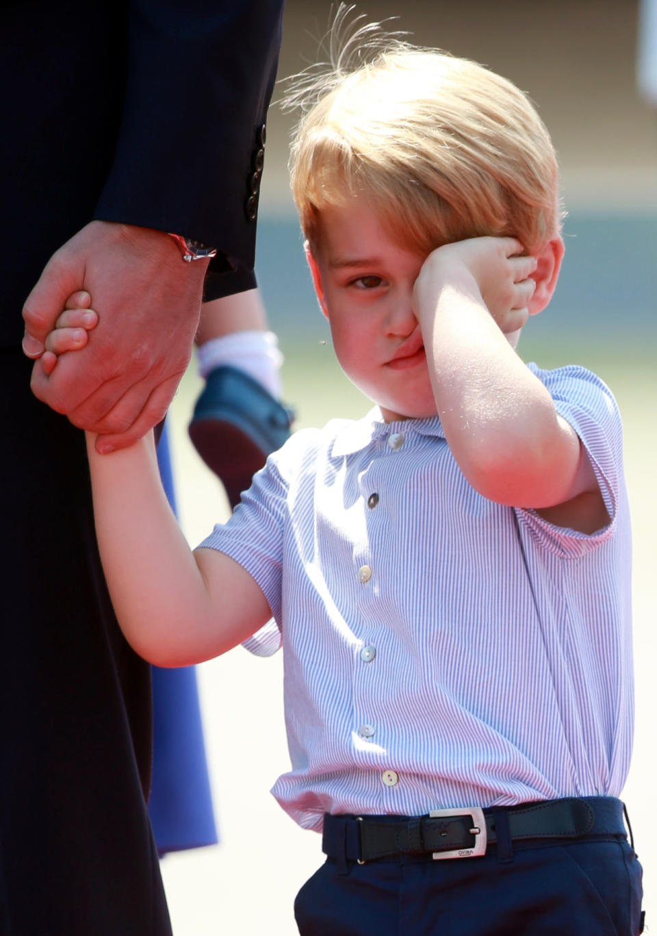 Two days later, George appeared exhausted as he was photographed landing in Germany for the second half of the royal tour. 