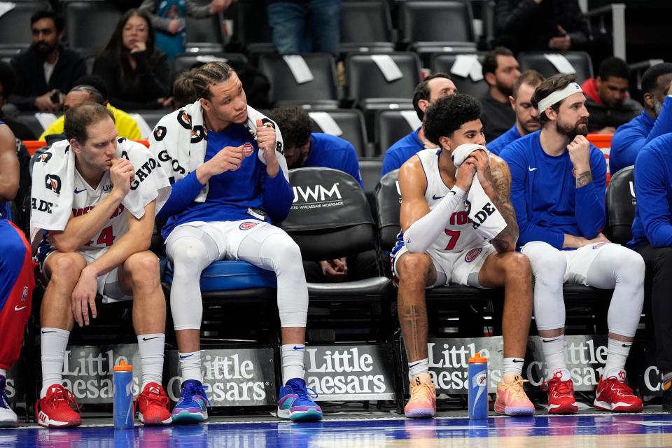 From left: Pistons forwards Bojan Bogdanovic, Kevin Knox II, guard Killian Hayes and forward Joe Harris during the closing minutes of the Pistons' 130-108 loss to the Spurs on Wednesday, Jan. 10, 2024, at Little Caesars Arena.