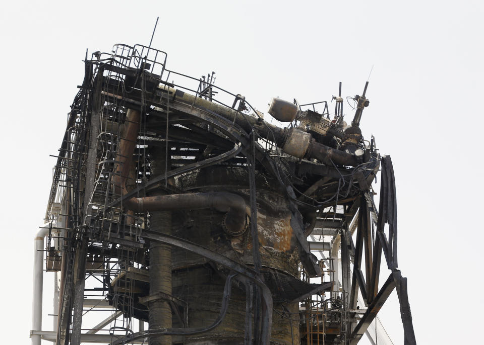 In this photo opportunity during a trip organized by Saudi information ministry, damaged structures are seen in the Aramco's Khurais oil field, Saudi Arabia, Friday, Sept. 20, 2019, after it was hit during Sept. 14 attack. Saudi officials brought journalists Friday to see the damage done in an attack the U.S. alleges Iran carried out. Iran denies that. Yemen's Houthi rebels claimed the assault. (AP Photo/Amr Nabil)