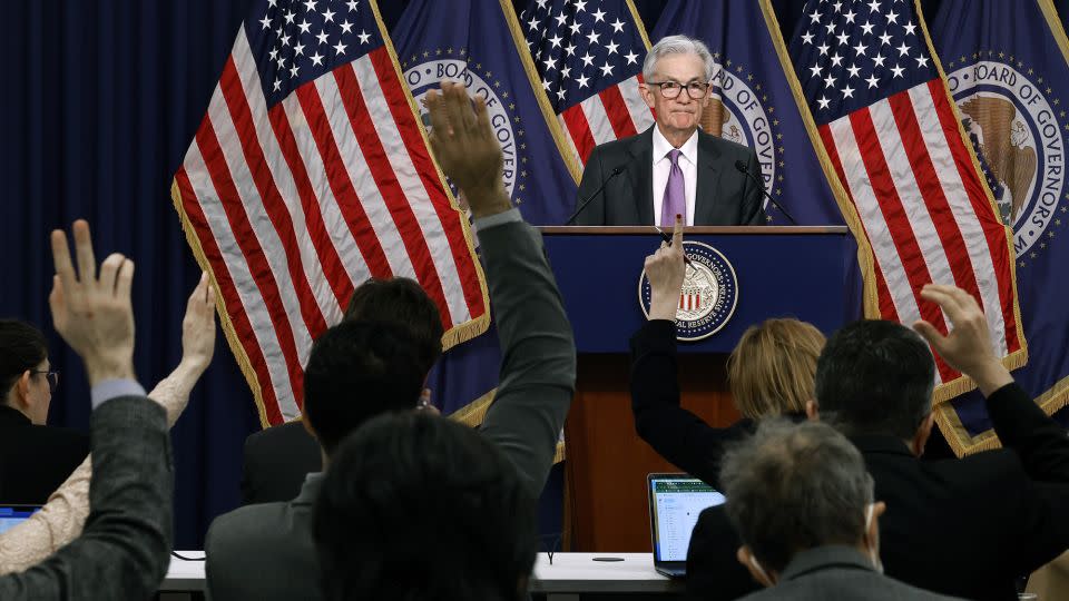 Reporters raise their hands to ask questions of Federal Reserve Chair Jerome Powell during a post-meeting press conference on March 20, 2024, in Washington, DC. - Chip Somodevilla/Getty Images