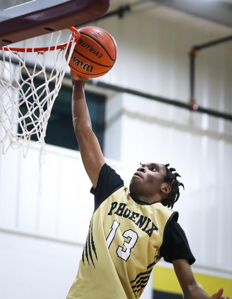 Carlucci Paul of New Heights Charter dunks during a game against Codman Academy on Monday, Jan. 9, 2023.