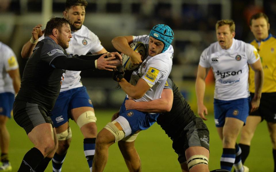 Zach Mercer is tackled by Jon Welsh and Calum Green - Getty Images Europe