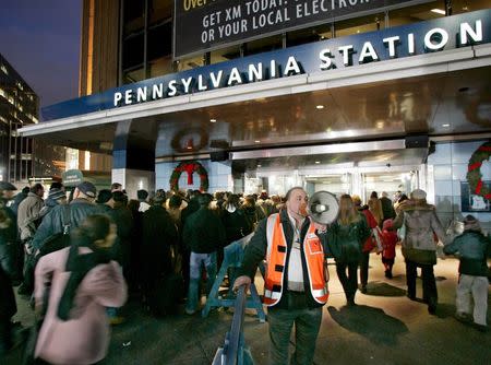 Commuters are directed to train lines at Penn Station during the second day of a Metropolitan Transit Authority (MTA) strike in New York, in this December 21, 2005 file photo. REUTERS/Ray Stubblebine/Files