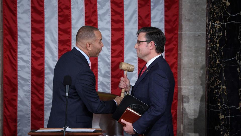 hakeem jeffries handing mike johnson his gavel as new speaker of the house