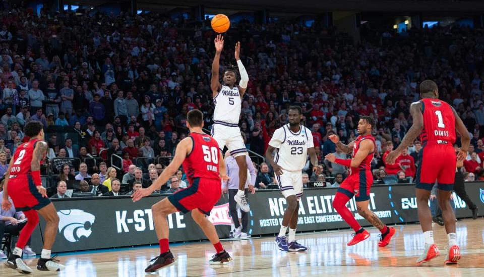 Kansas State’s Cam Carter hits a three-pointer late in the game against Florida Atlantic to keep the Wildcats’ hopes alive at Madison Square Garden on Saturday night.