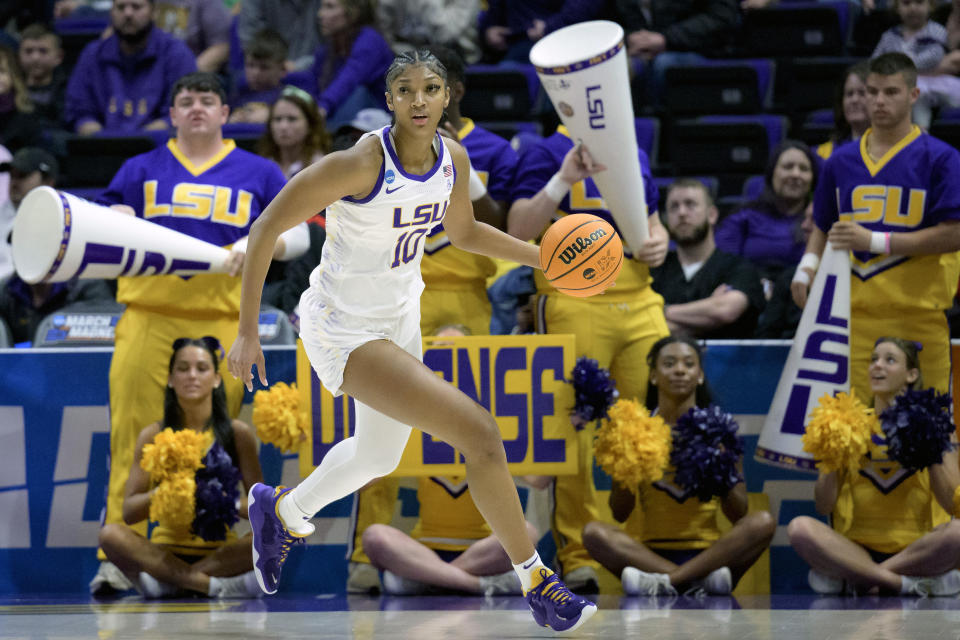 FILE - LSU forward Angel Reese (10) dribbles during a first-round college basketball game in the women's NCAA Tournament in Baton Rouge, La., Friday, March 17, 2023. Coming off the school's first NCAA women's basketball championship, LSU is ranked No. 1 in the AP Top 25 preseason women's basketball poll, released Tuesday, Oct. 17, 2023. There's clearly a lot of optimism around LSU as they return a stellar group, including Angel Reese and added two huge transfers with Hailey Van Lith and Aneesah Morrow.(AP Photo/Matthew Hinton, File)