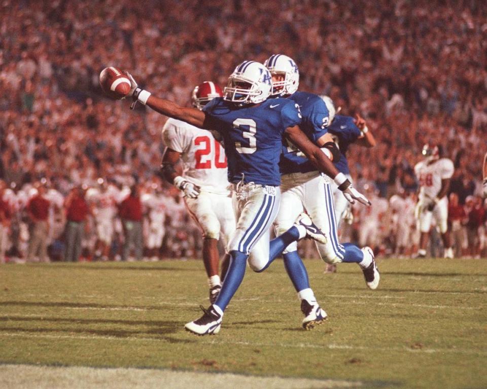 UK’s Craig Yeast (3) crosses the goal line, scoring the game winning touchdown in overtime against Alabama in Commonwealth Stadium Sat Oct 4, 1997.