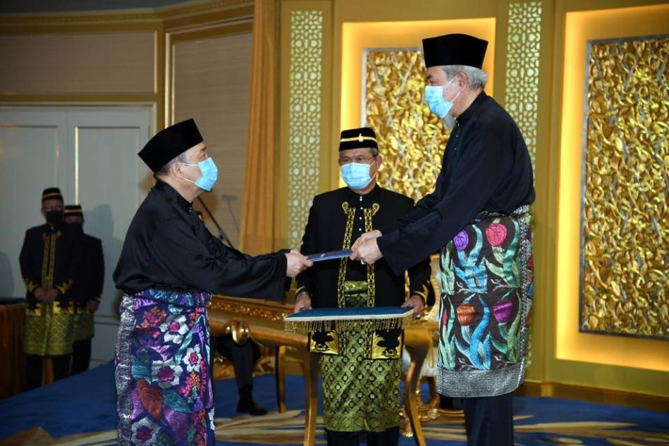 Datuk Hajiji Noor (left) receives his letter of appointment as Sabah chief minister from the Yang di-Pertua Negeri Tun Juhar Mahiruddin at Istana Negeri, Kota Kinabalu September 29, 2020. — Bernama pic