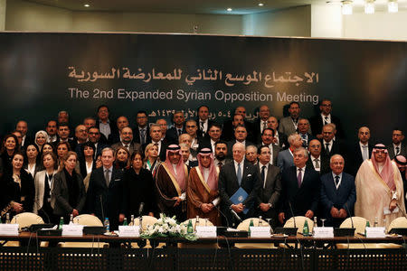 Saudi Foreign Minister Adel al-Jubeir poses for a group photo during a Syrian opposition meeting in Riyadh, Saudi Arabia, November 22, 2017. REUTERS/Faisal Al Nasser