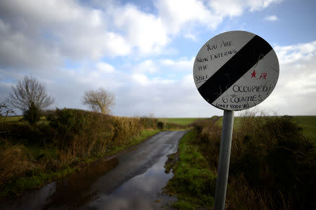 A road which crosses the border from County Donegal in Ireland to County Londonderry in Northern Ireland, is seen from near the border village of Lenamore, Ireland, February 1, 2018. There are no markings apart from the change in roadsigns. REUTERS/Clodagh Kilcoyne