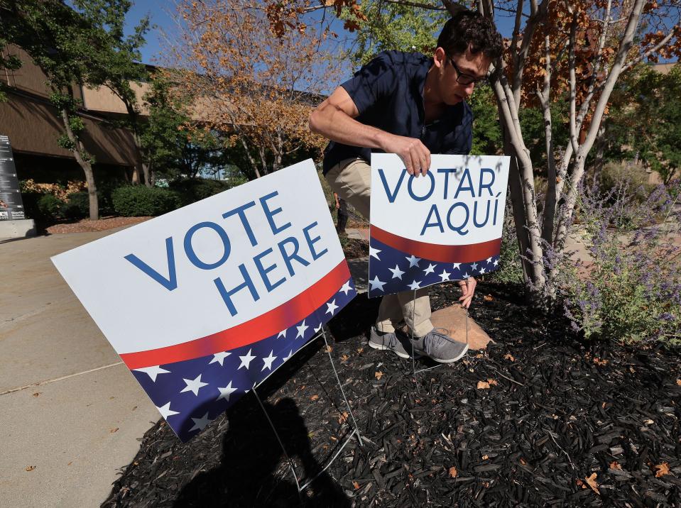 Election coordinator Dimitri Sakellariou displays voting signs during Utah’s municipal and primary elections, which include the 2nd Congressional District special primary, at the Salt Lake County Government Center in Salt Lake City on Tuesday, Sept. 5, 2023. | Jeffrey D. Allred, Deseret News