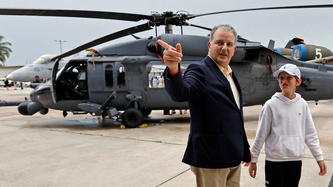 Florida Chief Financial Officer Jimmy Patronis tours the aircraft on exhibit with his son Johnny Patronis during the National Salute to America’s Heroes presented by Hyundai Air & Sea Show/U.S. Army Salute Fest at the US Coast Guard Air Station in Opa-locka, Florida on Friday, May 26, 2023.