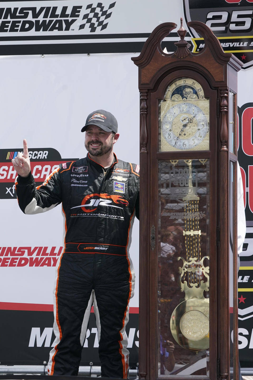 Josh Berry poses with the winners trophy as he celebrates winning the rain delayed NASCAR Xfinity Series auto race at Martinsville Speedway in Martinsville, Va., Sunday, April 11, 2021. (AP Photo/Steve Helber)