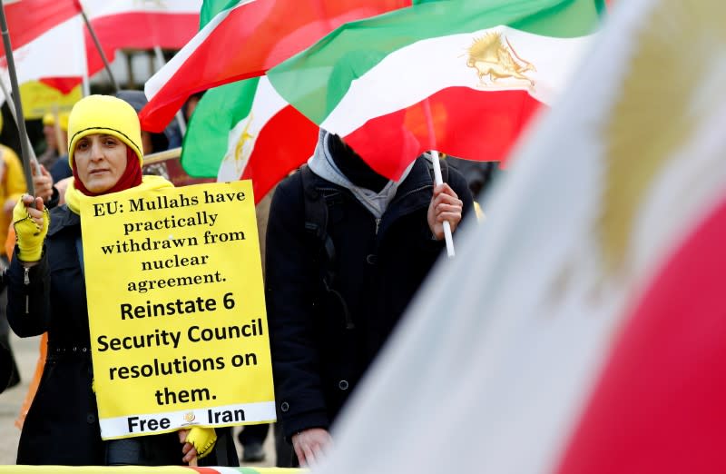 Supporters of the National Council of Resistance of Iran (NCRI) protest as European Union foreign ministers attend an emergency meeting in Brussels