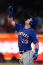 New York Mets' James McCann (33) gestures after driving in a run with a double in the seventh inning of a baseball game against the Atlanta Braves, Monday, May 17, 2021, in Atlanta. (AP Photo/John Bazemore)