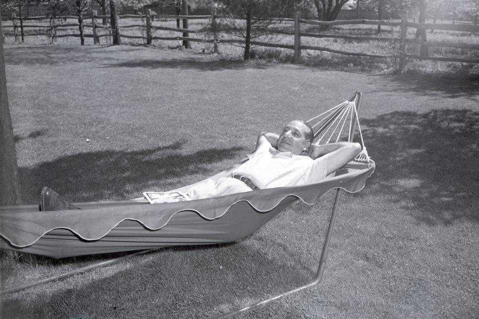 Costello lounging in a hammock at home.