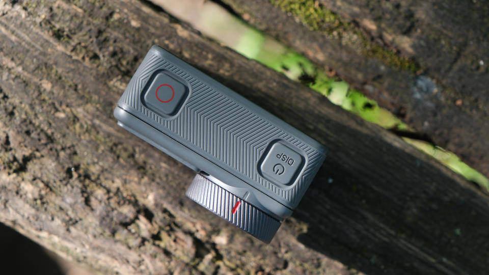 Akaso Brave 8 Lite action camera top down view on a wooden surface outside