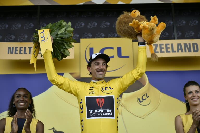 Fabian Cancellara celebrates his overall leader yellow jersey on the podium at the end of the 166 km second stage of the 102nd edition of the Tour de France on July 5, 2015 in Vrouwenpolder, in Zeeland province, The Netherlands