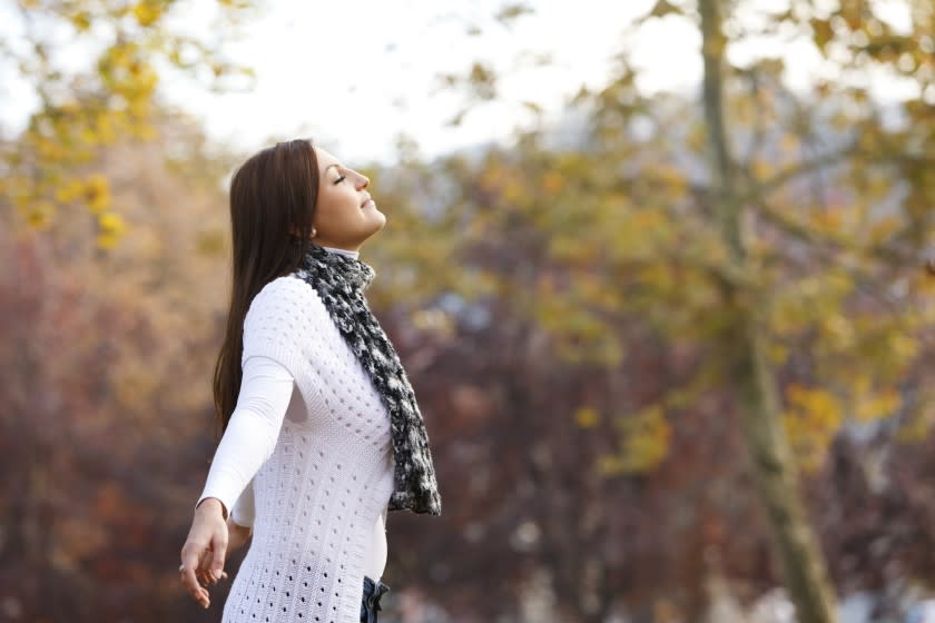 Pretty young woman enjoying the nature