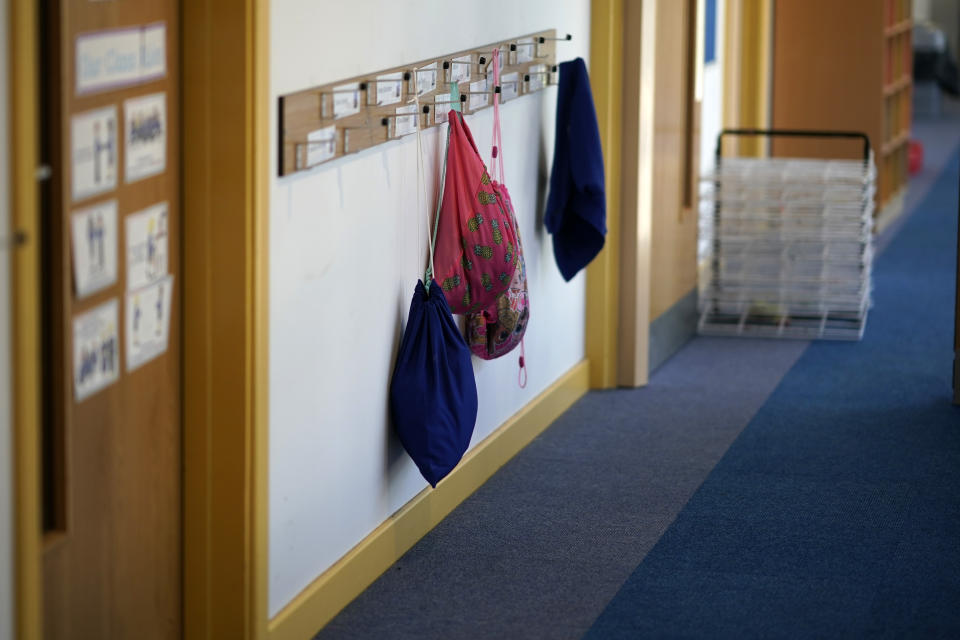 ALTRINCHAM, ENGLAND - APRIL 08:  Children's PE bags hang on coat hooks at Oldfield Brow Primary School during the coronavirus lockdown on April 08, 2020 in Altrincham, England. The government announced the closure of UK schools from March 20 except for the children of key workers, such as NHS staff, and vulnerable pupils, such as those looked after by local authorities. The prime minister has said schools will remain closed "until further notice," and many speculate they may not reopen until next term. (Photo by Christopher Furlong/Getty Images)