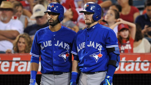 Jose Bautista of the Toronto Blue Jays wears the new red jersey