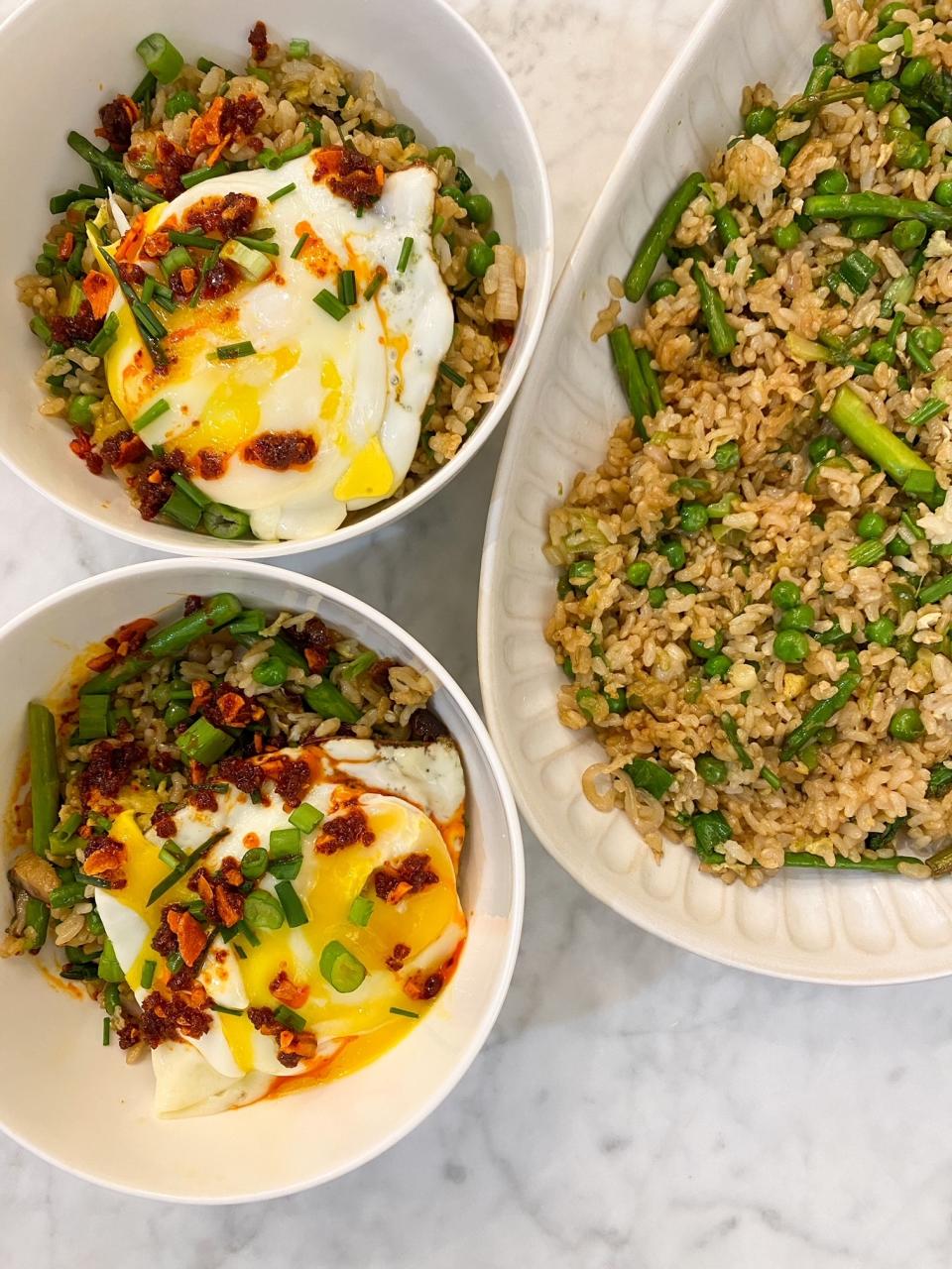 Bowls of fried rice topped with fried egg