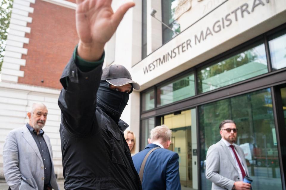 Metropolitan Police officer Thomas Phillips covers his face (James Manning/PA Wire)