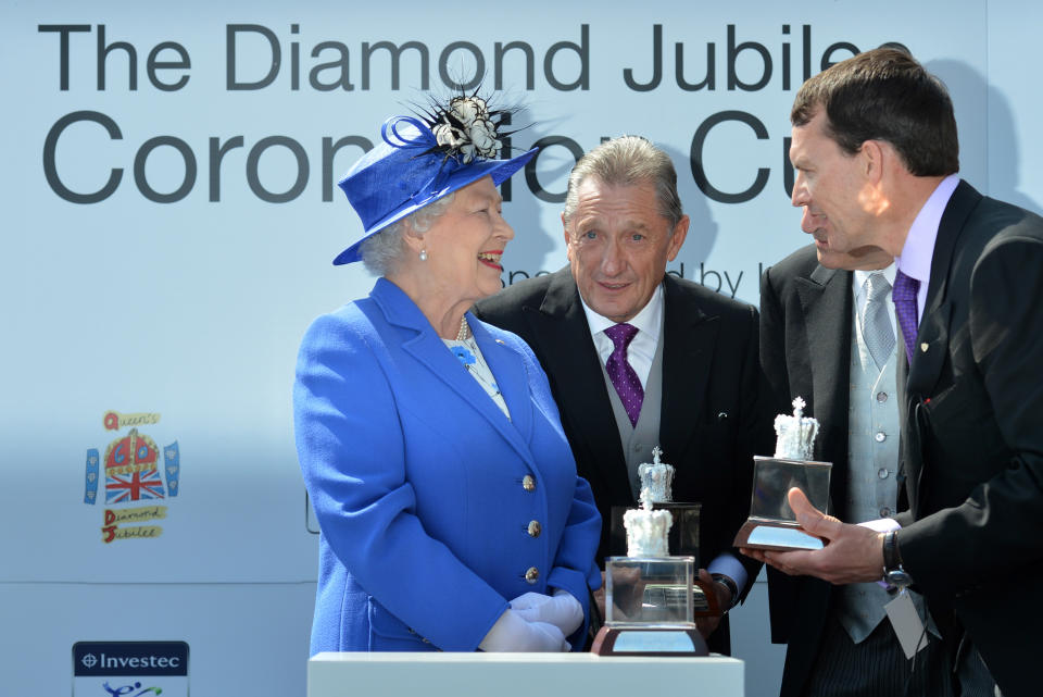 EPSOM, ENGLAND - JUNE 02:  Queen Elizabeth II (L) presents the trophy to Aidan O'Brien (R), the trainer of St Nicholas Abbey, after his horse won the Diamond Jubilee Coronation Cup on Derby Day on June 2, 2012 in Epsom, England. For only the second time in its history, the UK celebrates the Diamond Jubilee of a monarch. Her Majesty Queen Elizabeth II celebrates the 60th anniversary of her ascension to the throne. The Queen along with all the members of the royal family will participate in a River Pageant with a flotilla of 1,000 boats accompanying them down the Thames, a star studded free concert at Buckingham Palace, and a carriage procession and a Service of Thanksgiving at St Paul's Cathedral.  (Photo by Ben Stansall - WPA Pool /Getty Images)