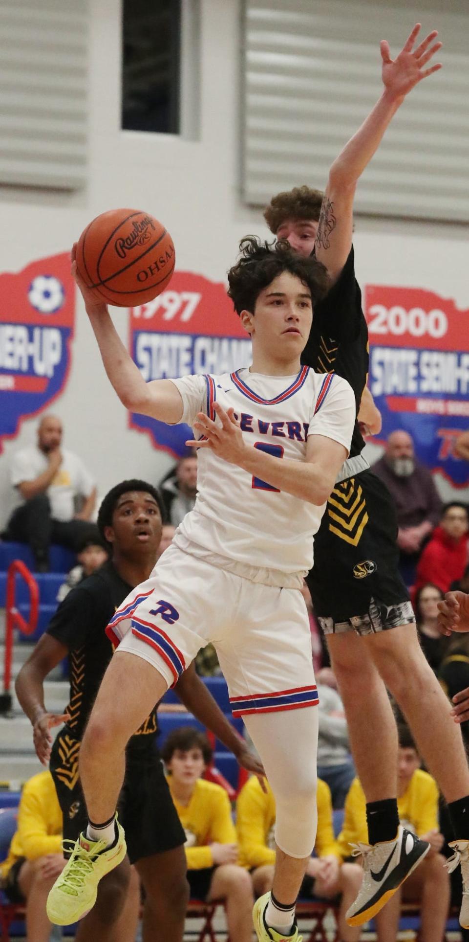 Revere's Evan Oravecz passes against Cuyahoga Falls during a basketball game at Revere High School on Friday, Jan. 20, 2023.