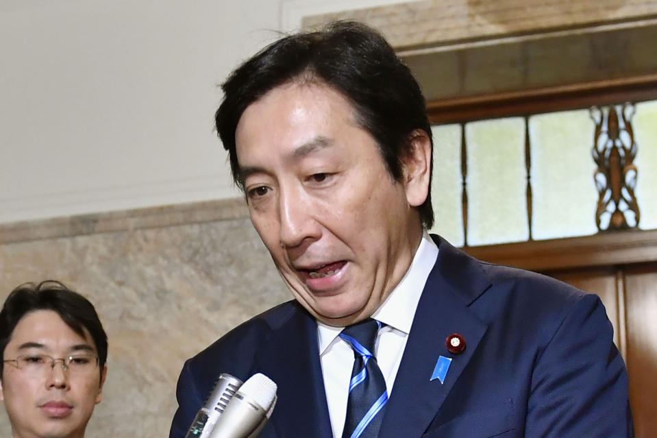 Japanese Trade Minister Isshu Sugawara speaks after a cabinet meeting at parliament in Tokyo Friday, Oct. 25, 2019. A report says Sugawara has offered his resignation on Friday after his office was accused of violating election laws. (Yoshitaka Sugawara/Kyodo News via AP)