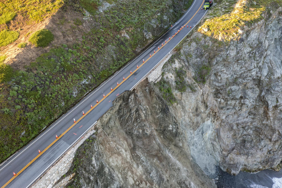 Cones mark a break in the southbound lane of Highway 1 at Rocky Creek Bridge in Big Sur, Calif., Monday, April 1, 2024, following an Easter weekend storm. (AP Photo/Nic Coury)