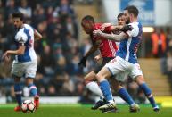 <p>Blackburn and United players tussle </p>