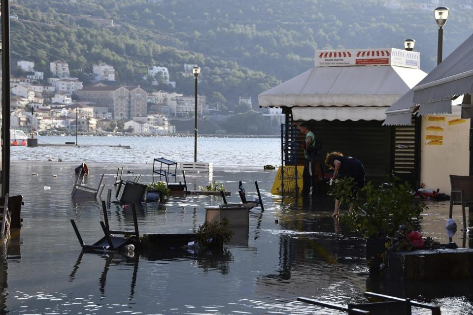 Seawater covers a square after an earthquake at the port of Vathi on the eastern Aegean island of Samos, Greece, Friday, Oct. 30, 2020. A strong earthquake struck in the Aegean Sea between the Turkish coast and the Greek island of Samos as the magnitude 6.6 earthquake was centered in the Aegean at a depth of 16.5 kilometers, or 10.3 miles.(AP Photo/Michael Svarnias)