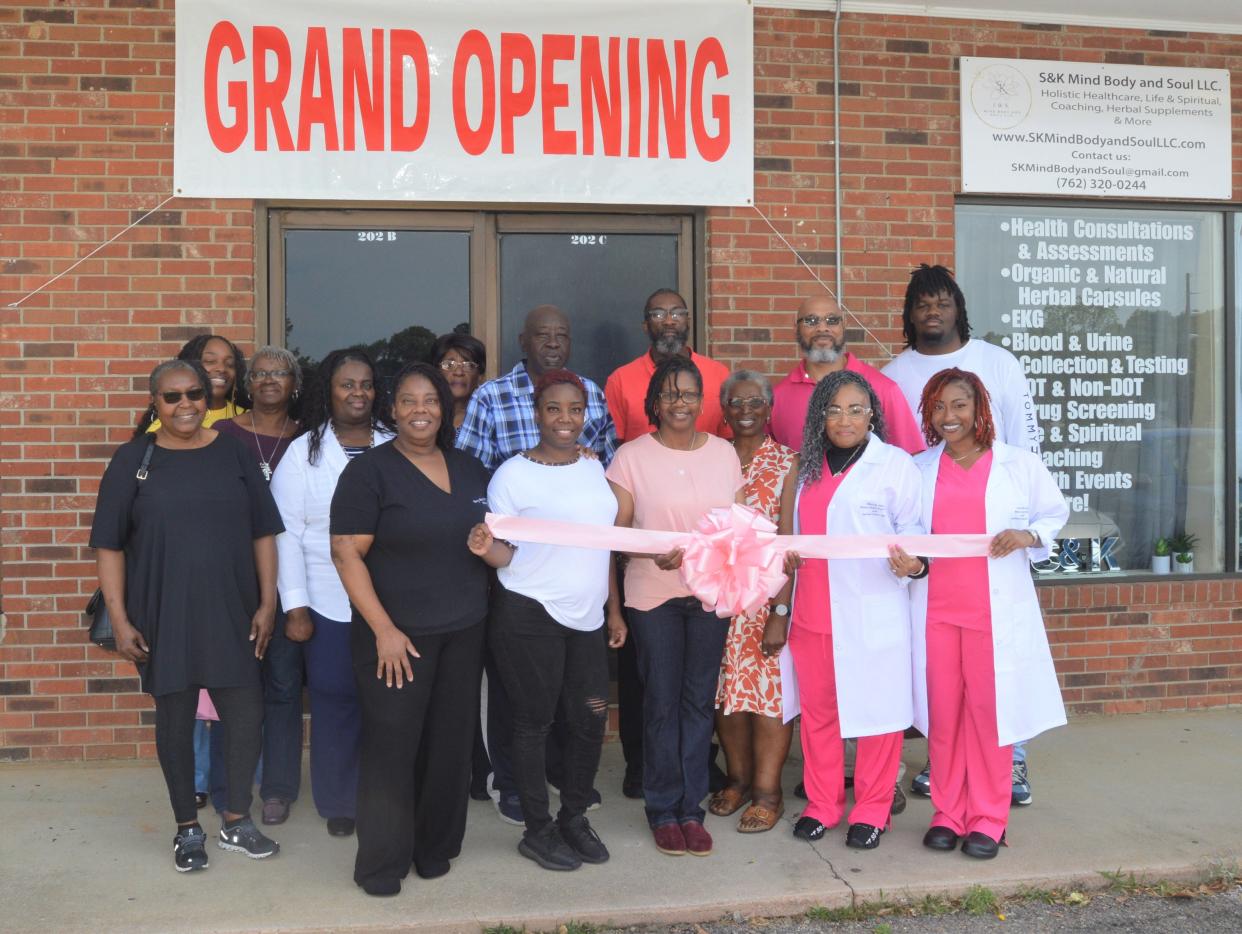 Owners, friends and family gather to cut the ribbon opening three new health and wellness businesses at 202 Thomson Hwy in Wrens: S&K Mind Body and Soul, Berry Bomb Candle Co. and Tree of Eternal Life.