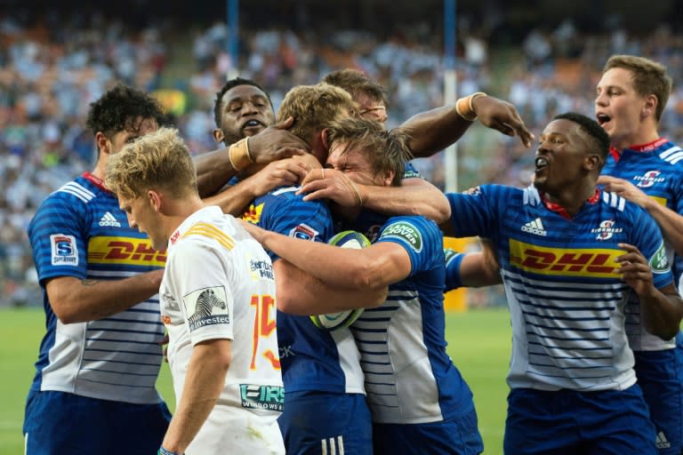 Stormers' South African fly-half Robert du Preez celebrates with his teammates after scoring a try against the New Zealand Waikato Chiefs on April 8, 2017 in Cape Town