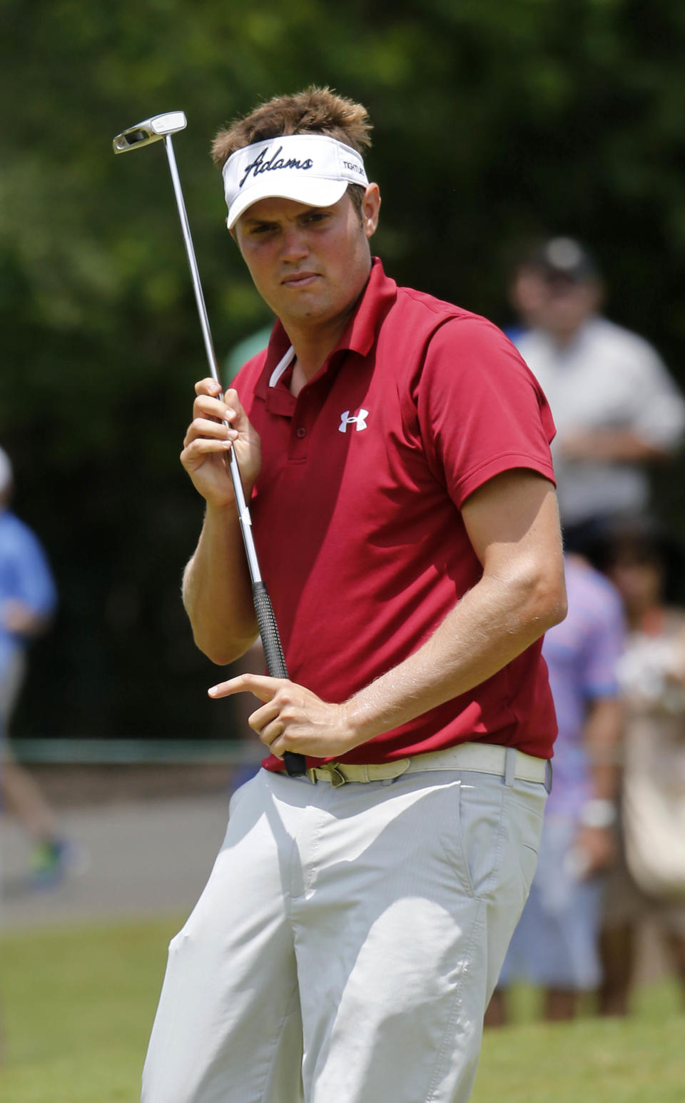 Jeff Overton reacts on the first green during the final round of the Zurich Classic golf tournament at TPC Louisiana in Avondale, La., Sunday, April 27, 2014. (AP Photo/Bill Haber)