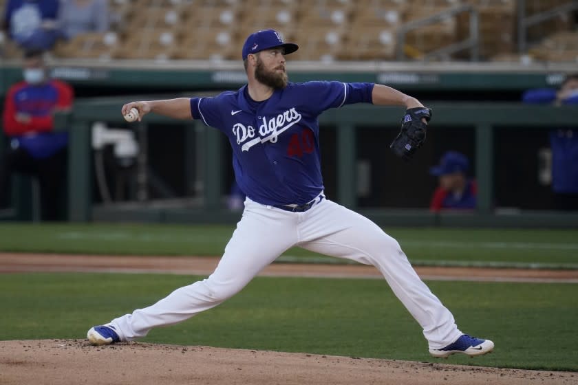 Los Angeles Dodgers pitcher Jimmy Nelson throws to a Chicago Cubs batter during the first inning of a spring training baseball game Thursday, March 4, 2021, in Phoenix. (AP Photo/Ross D. Franklin)