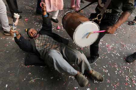 Supporters of Congress party celebrate after initial poll results at the party headquarters in New Delhi, December 11, 2018. REUTERS/Anushree Fadnavis