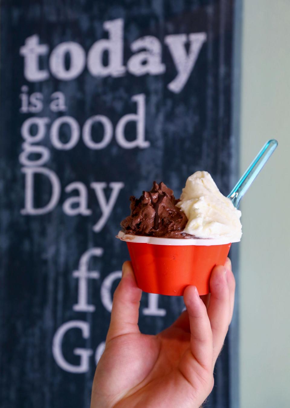 Matty Cairo holds a chocolate fudge brownie and vanilla combination cup at his Matty's Gelato Factory in Juno Beach.