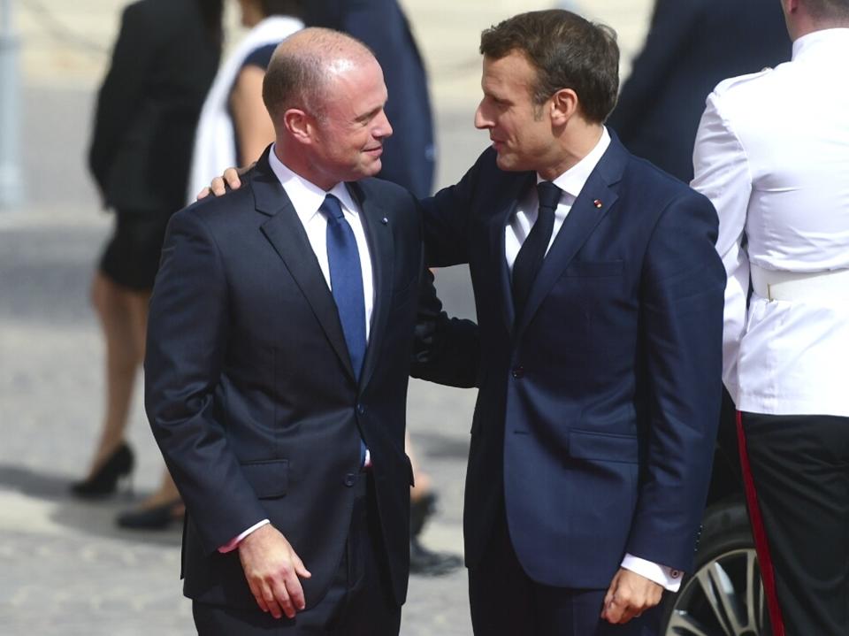 French President Emmanuel Macron, right, is welcomed by Malta Prime Minister Joseph Muscat on the occasion of the Mediterranean Summit of Southern EU countries in Valetta, Malta, Friday, June 14, 2019. (AP Photo/Jonathan Borg)