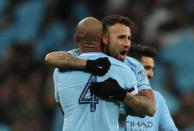 Soccer Football - Carabao Cup Final - Arsenal vs Manchester City - Wembley Stadium, London, Britain - February 25, 2018 Manchester City's Vincent Kompany and Nicolas Otamendi celebrate after the match Action Images via Reuters/Peter Cziborra