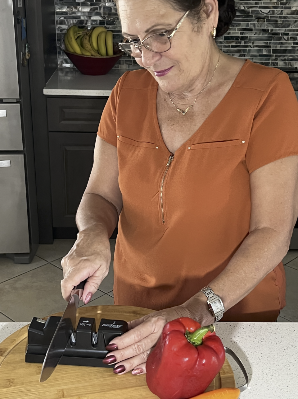 Beatriz Urquiola of Melbourne demonstrates the Angle Pro 2 knife sharpener.