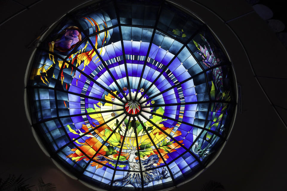 A stained-glass dome titled The Second Innocence, the Dream of Dionisyos, by Italian artist Narcissus Quagliata decorates the El Santuario Resort hotel in Valle de Bravo, Mexico, Wednesday, Oct. 25, 2023. Over the last five decades, Quagliata has created these stained-glass artworks for sacred spaces, private homes and public exhibitions, using a fusible glass technique. (AP Photo/Ginnette Riquelme)