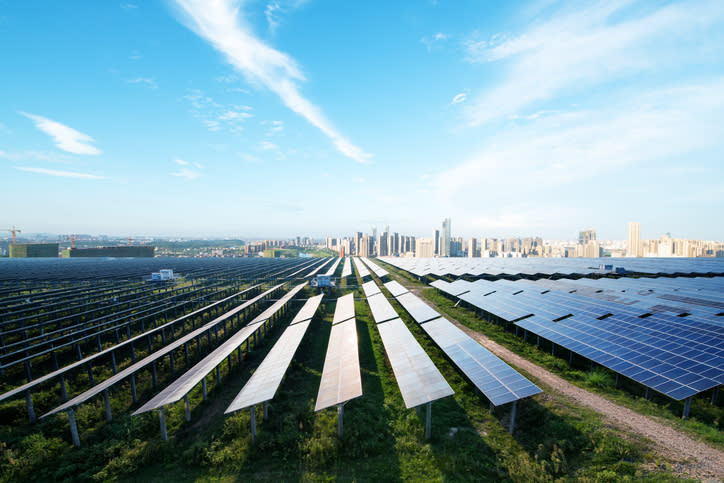 A solar farm near a city.