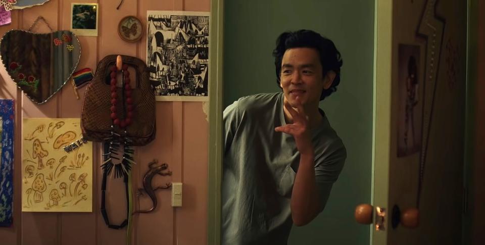 John Cho looks through a doorway