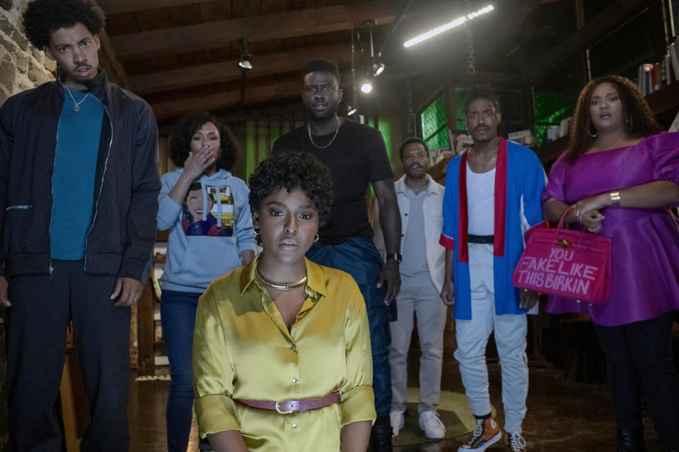 This image released by Lionsgate shows, from left, Melvin Gregg as King, Grace Byers as Allison, Antoinette Robertson as Lisa, Sinqua Walls as Nnamdi, Jermaine Fowler as Clifton, Dewayne Perkins as Dewayne, and Xochitl Mayo as Shanika in a scene from "The Blackening." (Glen Wilson/Lionsgate via AP)