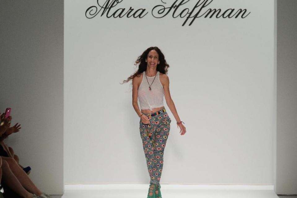 In this Saturday, Sept. 7, 2013, photo, provided by Mara Hoffman, fashion designer Mara Hoffman walks the runway after showing her Mara Hoffman Spring 2014 collection is modeled during Fashion Week in New York. (AP Photo/Mara Hoffman)