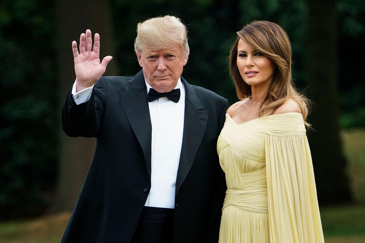 The First Lady opted to wear a caped, lemon yellow J. Mendel dress last night [Photo: Getty]