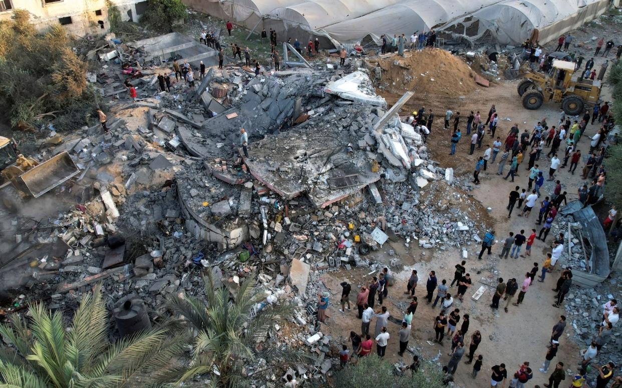 A view shows the remains of a Palestinian house destroyed in Israeli strikes in the central Gaza Strip October 15, 2023.